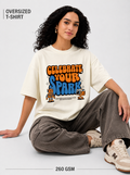 Person wearing an oversized t-shirt with 'Celebrate Your Spark' text and graphics on a light gray background.