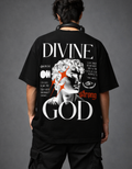 Person wearing a black t-shirt with 'Divine Strong God' design on the back against a gray background