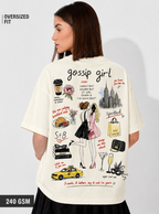 Woman wearing a 'gossip girl' themed t-shirt with illustrations and text on a plain background