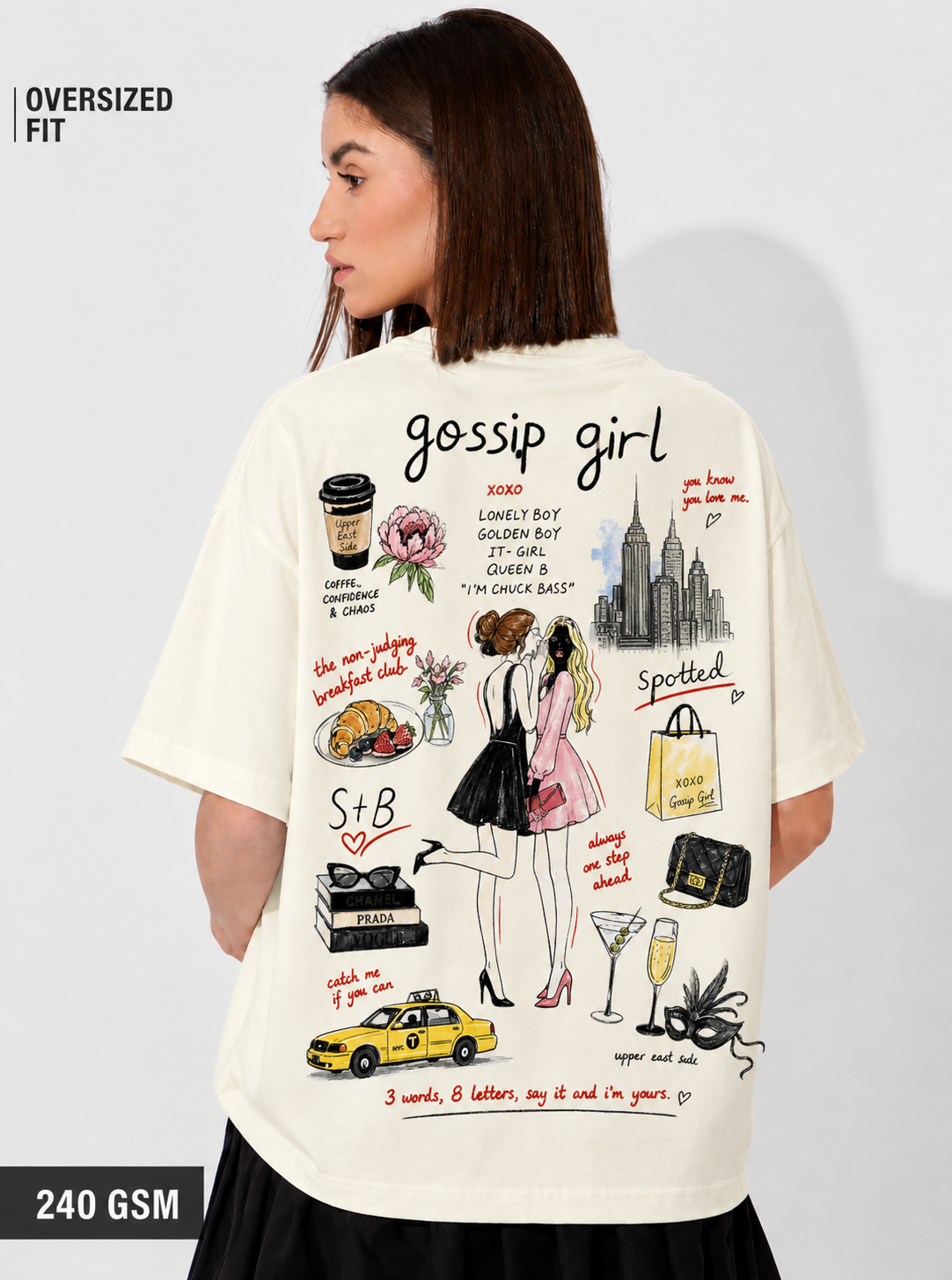 Woman wearing a 'gossip girl' themed t-shirt with illustrations and text on a plain background