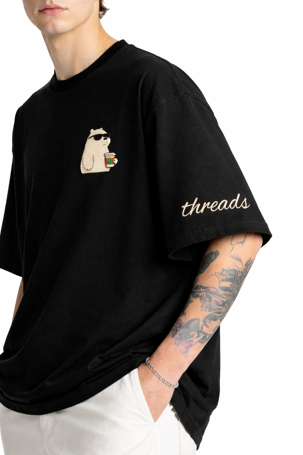 Person wearing a black t-shirt with a graphic of a pug and the word 'threads' on a white background