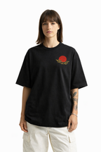 Person wearing a black t-shirt with a red and gold graphic design on a white background
