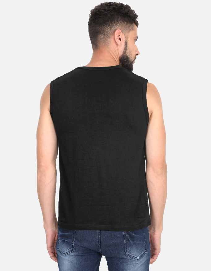 Man wearing a black sleeveless shirt with a logo on the back against a white background