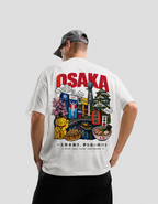 Person wearing a white t-shirt with Osaka-themed graphics and text on the back.