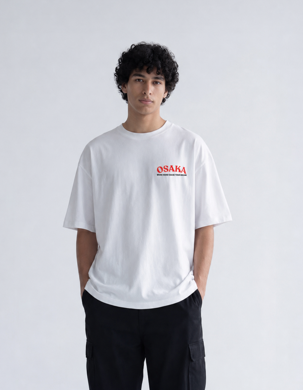 Person wearing a white t-shirt with 'OSAKA' printed on it against a plain background