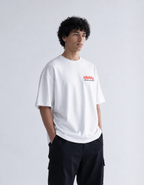 Person wearing a white t-shirt with 'OSAKA' printed on it against a plain background