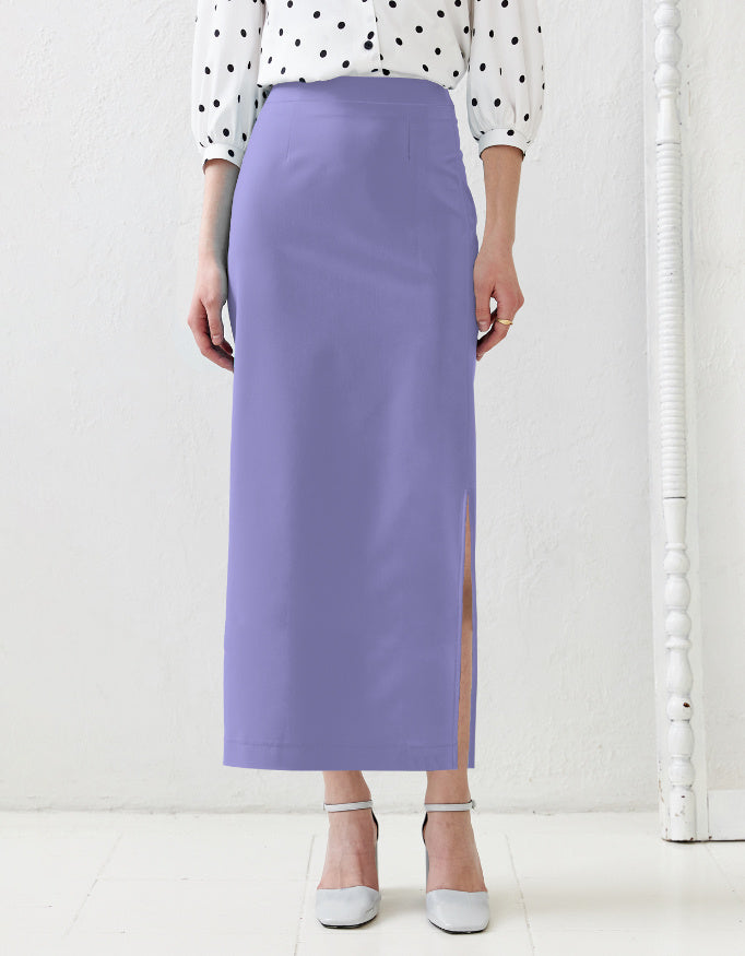 Person wearing a light purple pencil skirt with a white background