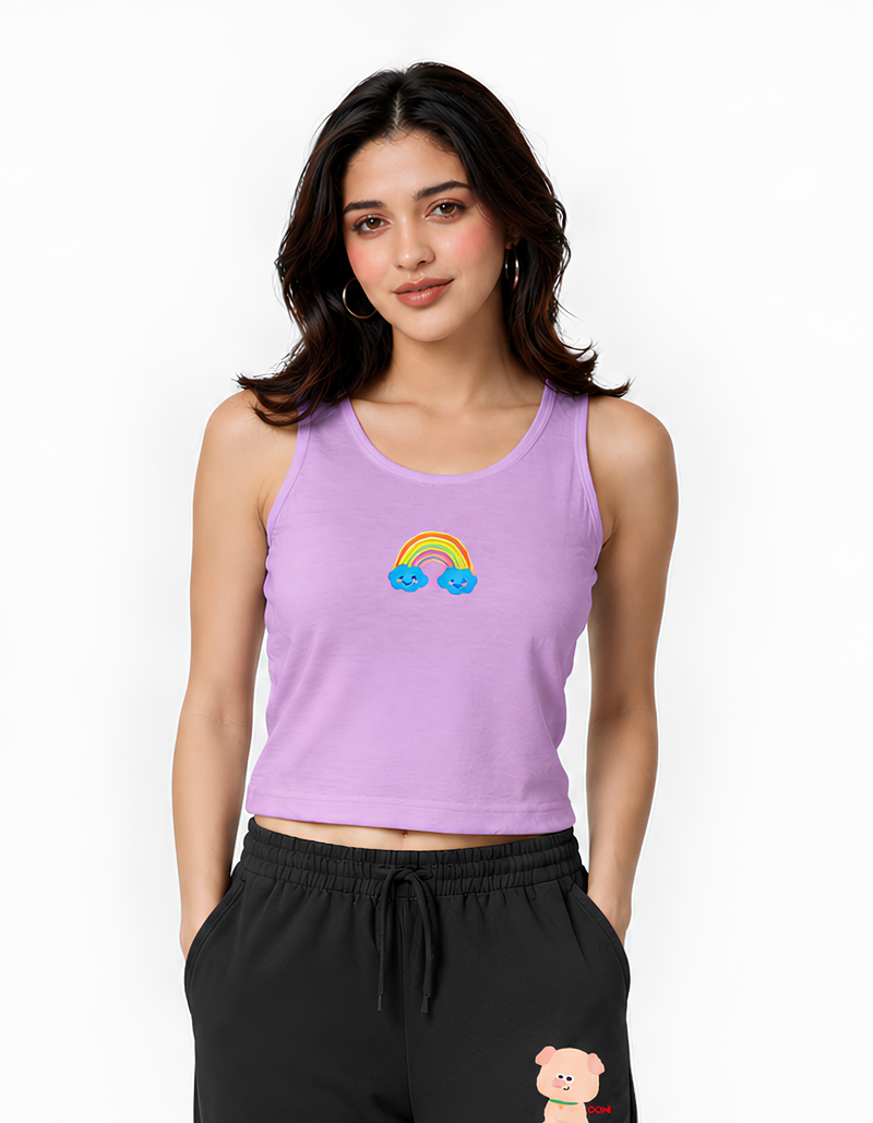 Woman wearing a purple tank top with a rainbow design on a white background