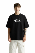 Person wearing a black t-shirt with 'Star' logo on a white background