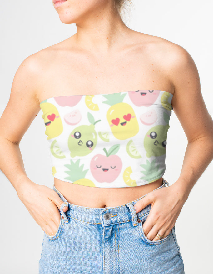 Person wearing a strapless top with cartoon fruit design and high-waisted jeans on a plain background